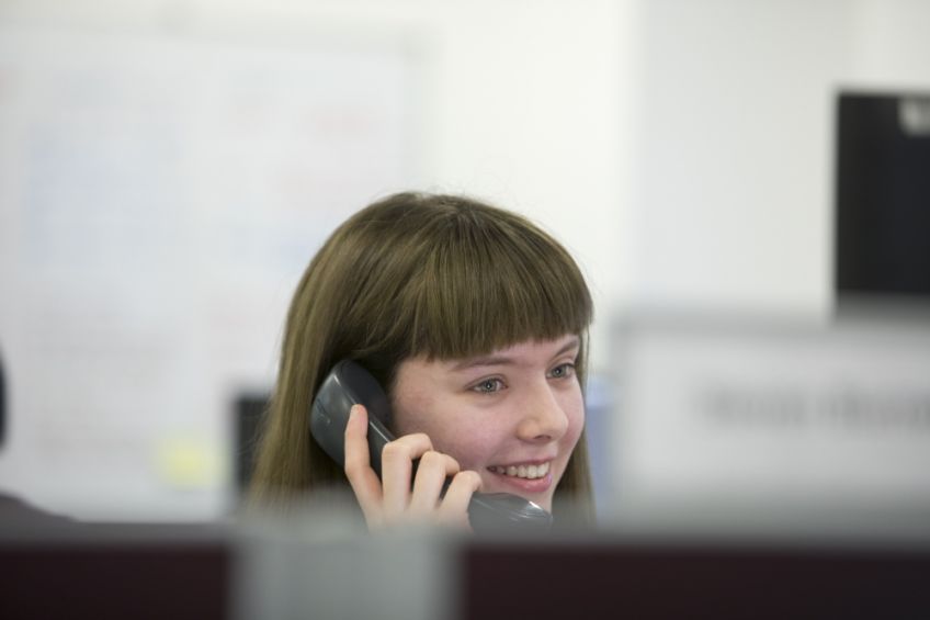 Woman on phone talks to customer