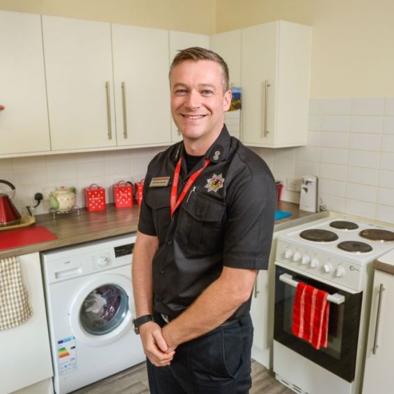 Fire officer in kitchen