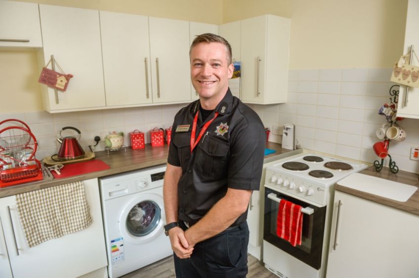 Fire officer in kitchen