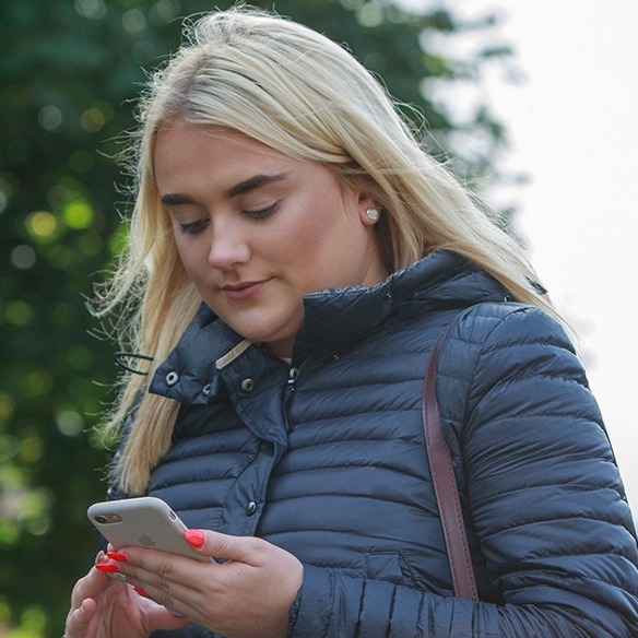 Picture of a person holding a phone