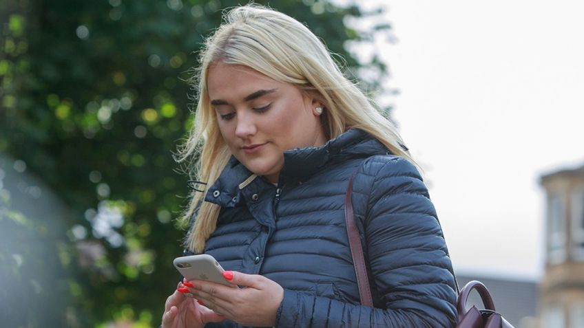 Picture of a person holding a phone