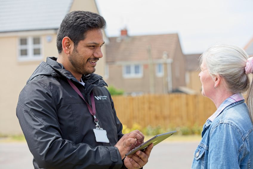 Housing Officer speaking to a customer