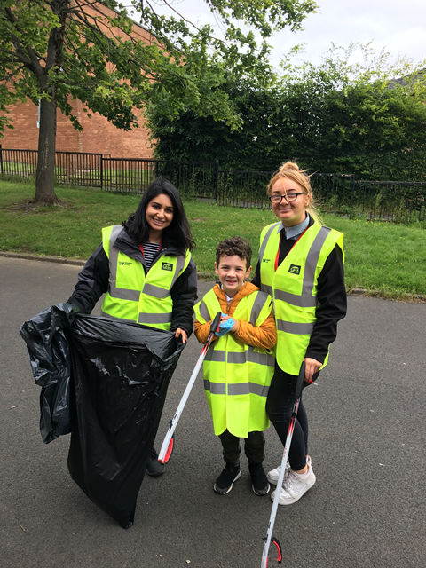 School kids help with the clear up in Darnley